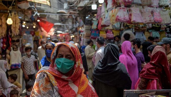 People walk in a market in this undated image of a market. — AFP/File